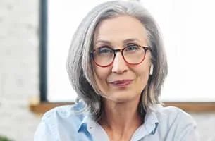 Career Marketing Techniques - middle aged female with glasses and a blue shirt