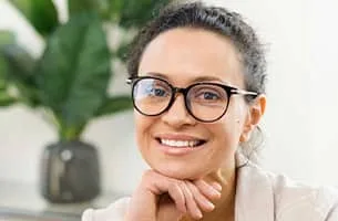 Career Marketing Techniques - middle aged black female with glasses and a beige jacket